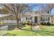 Charming home with black shutters, a covered carport, and a well-maintained lawn at 2246 Arrowhead Rd, Dunn, NC 28334