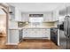 Functional kitchen with white cabinets, stainless steel appliances, and laminate countertops at 2246 Arrowhead Rd, Dunn, NC 28334