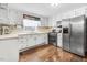 Functional kitchen with white cabinets, stainless steel appliances, and laminate countertops at 2246 Arrowhead Rd, Dunn, NC 28334