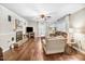 Inviting living room with hardwood floors, neutral paint, and fireplace at 2246 Arrowhead Rd, Dunn, NC 28334