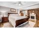 Cozy main bedroom with a brick fireplace and a white mantle at 2246 Arrowhead Rd, Dunn, NC 28334