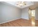 Large bedroom with a ceiling fan, tray ceiling and ensuite bathroom at 2301 Lemuel Dr, Raleigh, NC 27615