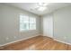 Light-filled bedroom with hardwood floors, a window, and a closet at 2301 Lemuel Dr, Raleigh, NC 27615