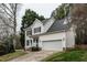 Charming two-story home with a well-manicured lawn, a two-car garage, and classic curb appeal at 2301 Lemuel Dr, Raleigh, NC 27615