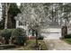 Beautiful home exterior enhanced by blooming tree and well-maintained landscaping at 2301 Lemuel Dr, Raleigh, NC 27615