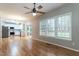 Open-concept living space with kitchen, dining area, and large windows offering ample natural light at 2301 Lemuel Dr, Raleigh, NC 27615