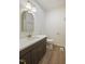 Bathroom featuring white countertops, dark vanity and gold hardware at 2312 Valley Rd, Sanford, NC 27330