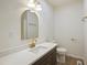 Bathroom featuring white countertops, dark vanity and gold hardware at 2312 Valley Rd, Sanford, NC 27330