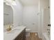 Bathroom featuring white countertops, dark vanity and gold hardware at 2312 Valley Rd, Sanford, NC 27330