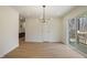 Bright dining area with sliding doors to the deck, contemporary lighting, and new floors at 2312 Valley Rd, Sanford, NC 27330