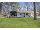 Well-kept ranch-style home featuring a lush green lawn and brick exterior at 2312 Valley Rd, Sanford, NC 27330