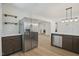 The kitchen features stainless steel appliances and a breakfast bar, perfect for modern living at 2312 Valley Rd, Sanford, NC 27330