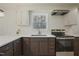 Bright kitchen showcasing stainless steel appliances, updated countertops, and ample natural light at 2312 Valley Rd, Sanford, NC 27330