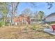 Brick home with a spacious backyard and mature trees at 2313 Prince St, Durham, NC 27707