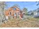 Charming brick home with a spacious backyard and mature trees at 2313 Prince St, Durham, NC 27707