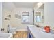 Bright bathroom with vanity, mirror, and wood-look flooring at 2313 Prince St, Durham, NC 27707