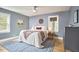 Charming bedroom with natural light, ceiling fan, and stylish decor at 2313 Prince St, Durham, NC 27707