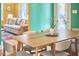 Bright dining room with a modern table and chairs, flowing into the living room at 2313 Prince St, Durham, NC 27707