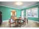 Bright dining room with a modern table and chairs, flowing into the kitchen at 2313 Prince St, Durham, NC 27707