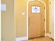 Foyer featuring an arched doorway and decorative window in the front door at 2313 Prince St, Durham, NC 27707