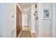 Inviting hallway with hardwood floors, storage closet, and wall decor at 2313 Prince St, Durham, NC 27707