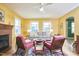 Bright living room with hardwood floors, fireplace, and lots of natural light at 2313 Prince St, Durham, NC 27707