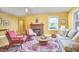 Cozy living room with a fireplace, hardwood floors, and comfortable seating at 2313 Prince St, Durham, NC 27707