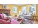 Cozy living room with a fireplace, hardwood floors, and lots of natural light at 2313 Prince St, Durham, NC 27707