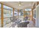 Cozy sunroom with wicker furniture and natural light at 2313 Prince St, Durham, NC 27707
