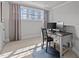 Bedroom featuring a desk, natural light, and neutral colors, creating a serene work space at 233 Candia Ln, Cary, NC 27519