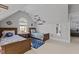 Spacious bedroom includes two twin beds, carpet, sports-themed décor, and good natural light through a large window at 233 Candia Ln, Cary, NC 27519