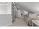 Bright bedroom with a comfortable daybed, open shelving, and plenty of natural light from the windows at 233 Candia Ln, Cary, NC 27519