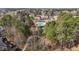 Aerial shot of a community pool with lounge seating surrounded by mature trees at 233 Candia Ln, Cary, NC 27519