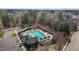 An aerial view of the community pool featuring covered seating and a nearby parking area at 233 Candia Ln, Cary, NC 27519