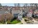 An aerial front view of a charming two-story house with a two car garage and a green lawn at 233 Candia Ln, Cary, NC 27519