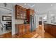 Kitchen includes wood cabinets, stainless steel refrigerator, and granite counters at 233 Candia Ln, Cary, NC 27519