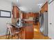 Kitchen features granite countertops, stainless steel appliances, and wood cabinetry at 233 Candia Ln, Cary, NC 27519