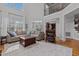 Spacious living room featuring a second-story overlook, large windows, and comfortable seating at 233 Candia Ln, Cary, NC 27519