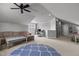 Spacious living room with a comfortable sectional sofa, ceiling fan, and plenty of natural light from the window at 233 Candia Ln, Cary, NC 27519