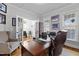 Bright home office with hardwood floors, french doors, and a large executive desk at 233 Candia Ln, Cary, NC 27519