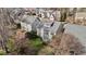 Aerial view of a two-story home with a well-maintained backyard and a small patio area at 233 Candia Ln, Cary, NC 27519