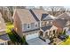 Aerial view of a two-story home with a manicured front yard and a two-car garage at 234 Macallan Dr, Burlington, NC 27215