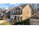 Aerial view of a two-story home with a manicured front yard and a detached garage at 234 Macallan Dr, Burlington, NC 27215