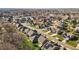 Extensive aerial shot of a well-planned community with homes, streets, and a tranquil lake in the background at 234 Macallan Dr, Burlington, NC 27215