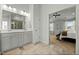 Bathroom with double vanity and entrance to main bedroom at 234 Macallan Dr, Burlington, NC 27215