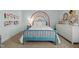 Bedroom view showcasing a rainbow accent wall, a comfy daybed, and dresser with a large window at 234 Macallan Dr, Burlington, NC 27215