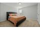 Stylish bedroom with a large bed, neutral walls, and ample natural light from the window at 234 Macallan Dr, Burlington, NC 27215