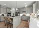 Updated kitchen showcasing stainless appliances, center island, and stylish gray cabinetry at 234 Macallan Dr, Burlington, NC 27215