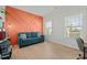 Stylish living room featuring a modern accent wall, comfortable seating, and bright natural light at 234 Macallan Dr, Burlington, NC 27215