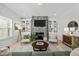 Inviting living room features a stone fireplace, built-in shelving, and comfortable seating arrangements at 234 Macallan Dr, Burlington, NC 27215